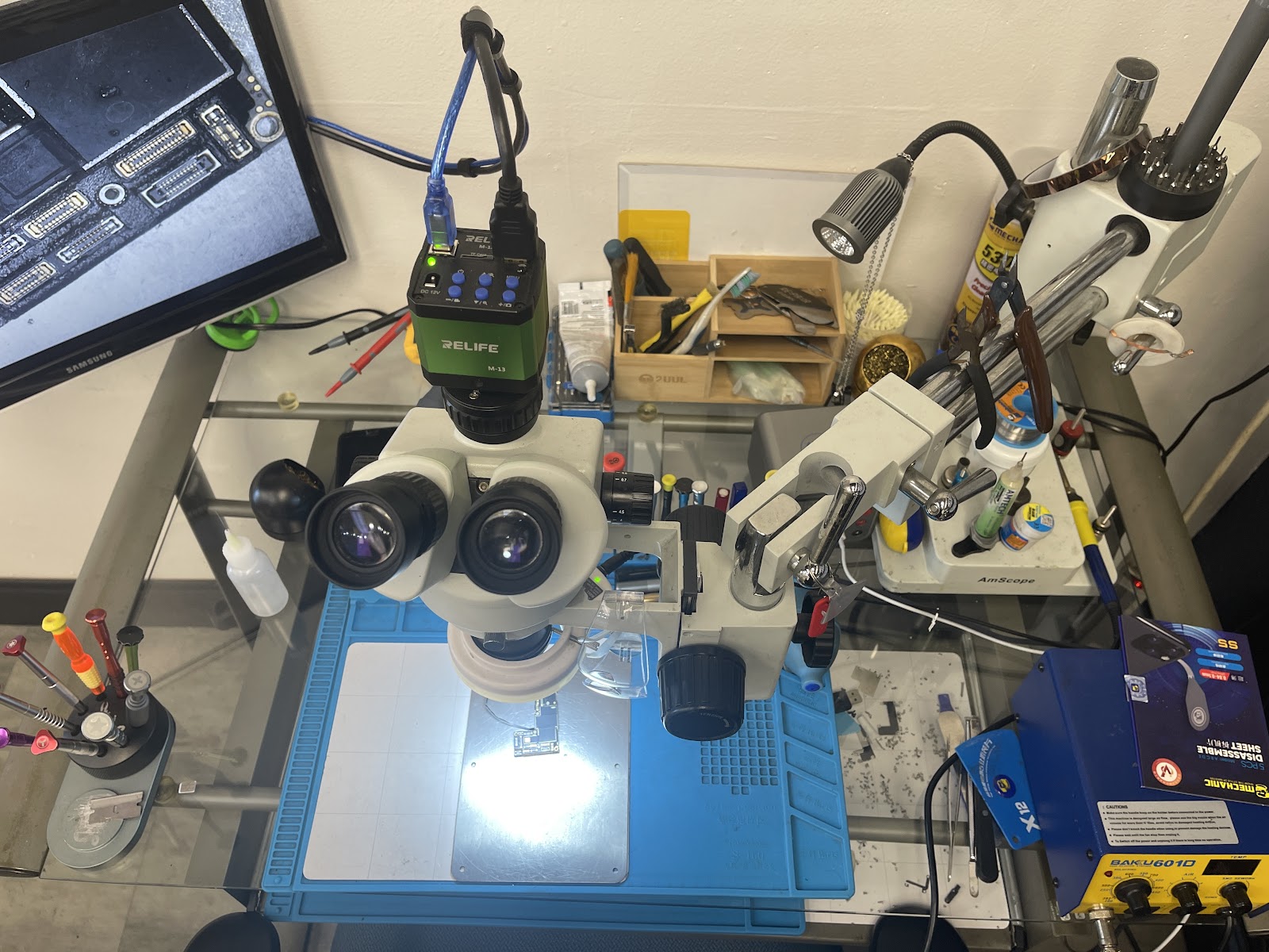 Technician working on a phone repair at iFix Repair Center's bench